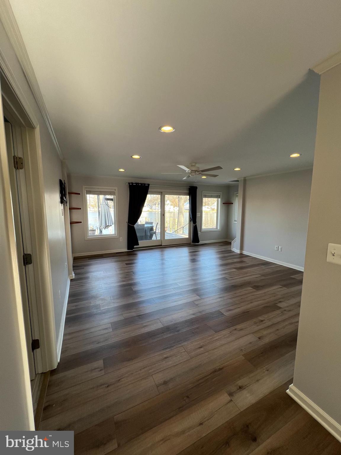 1890 Locust Road Pasadena, MD 21122 - Photo 47 of 53 an empty room with wooden floor and entrance