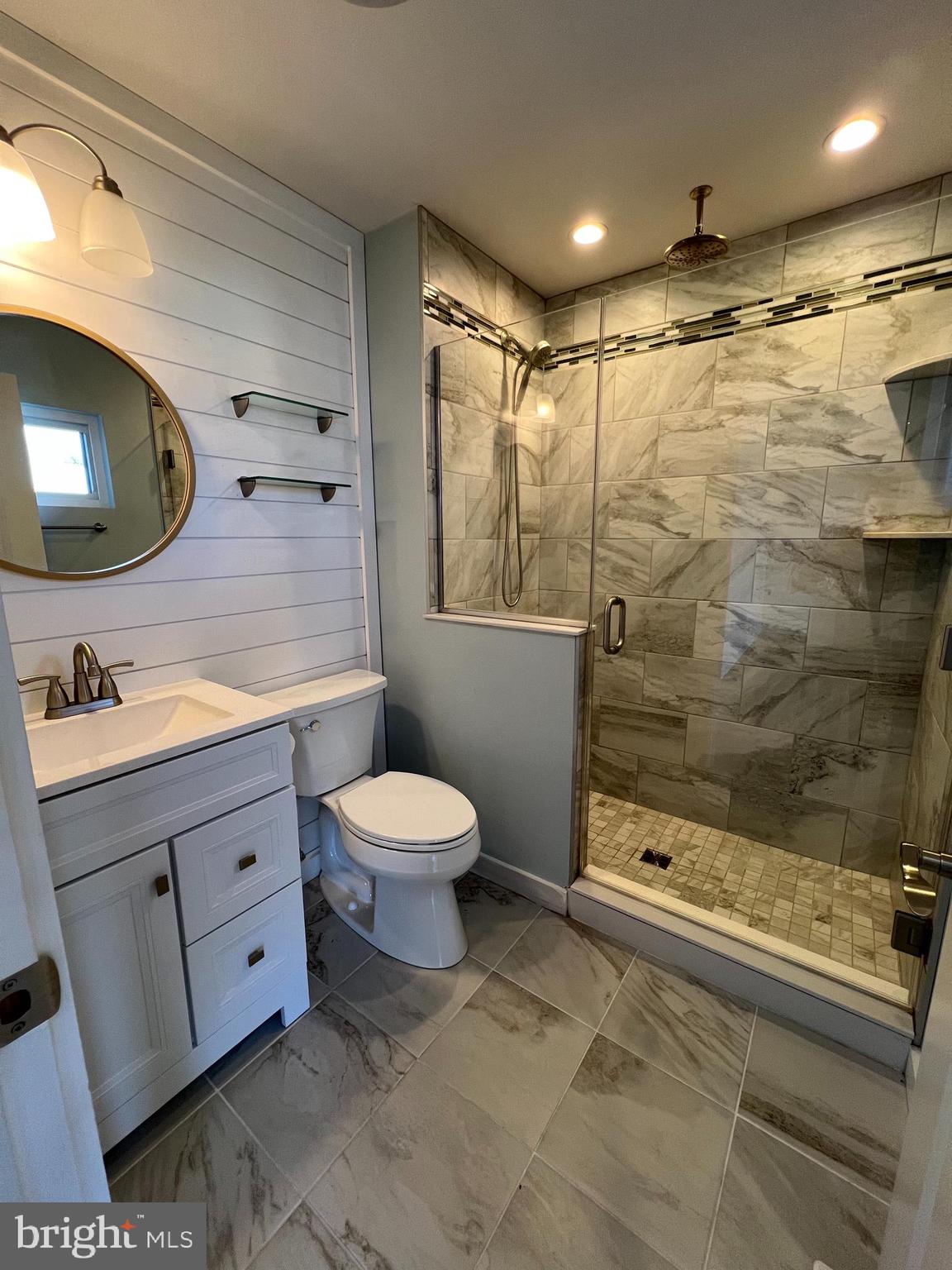 1890 Locust Road Pasadena, MD 21122 - Photo 53 of 53 a bathroom with a double vanity sink toilet and shower