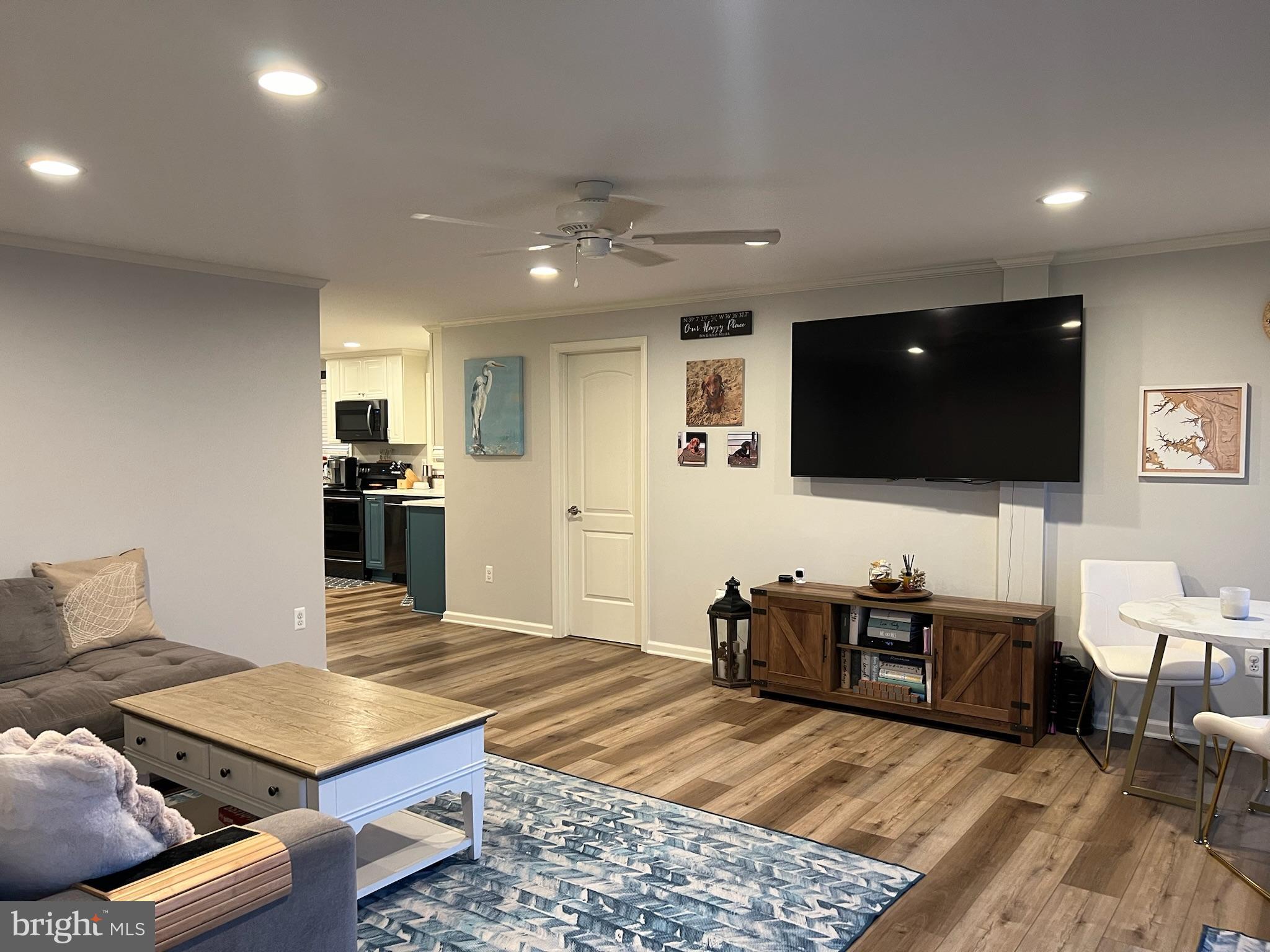 1890 Locust Road Pasadena, MD 21122 - Photo 7 of 53 a living room with furniture and a flat screen tv