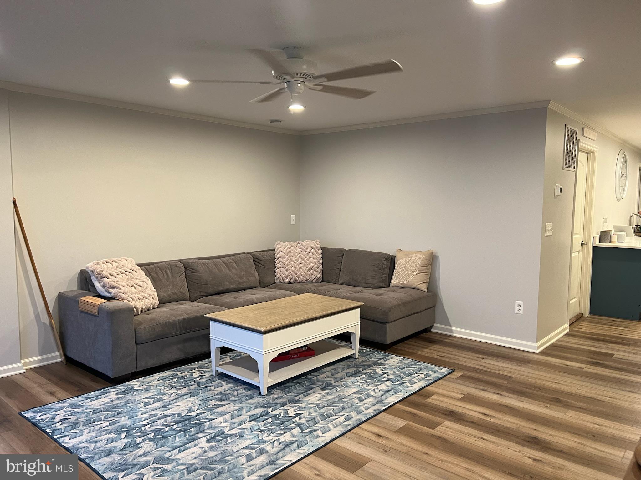 1890 Locust Road Pasadena, MD 21122 - Photo 8 of 53 a living room with furniture and a rug