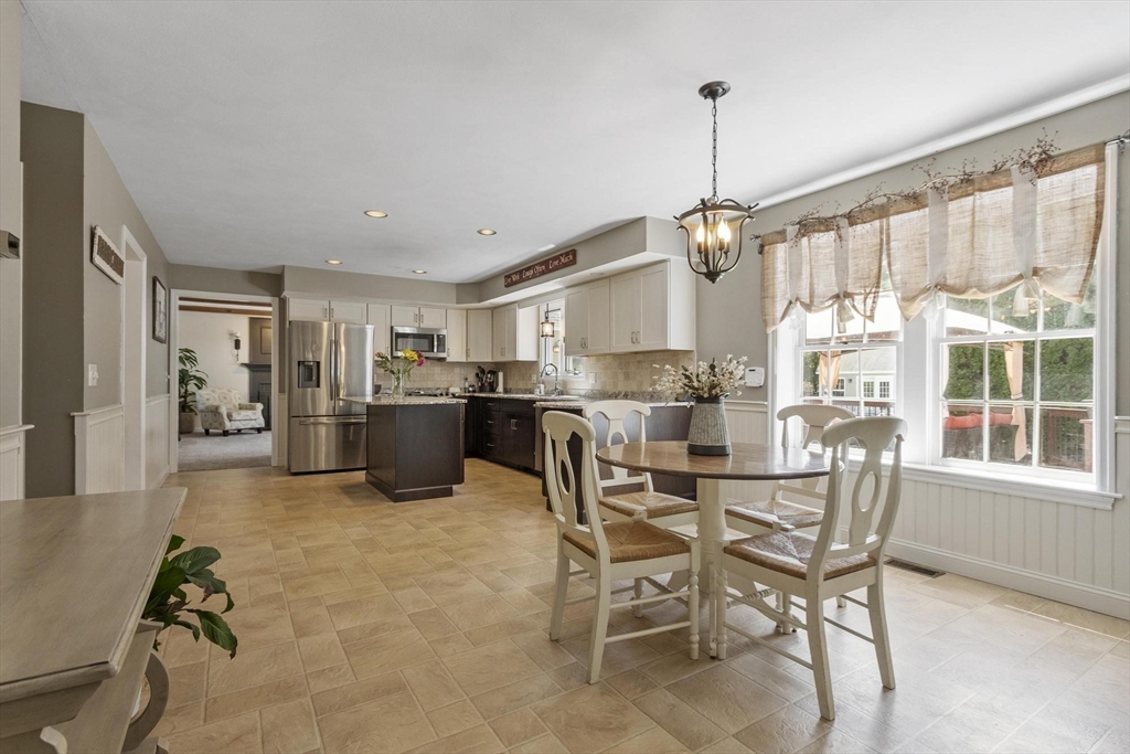 4 Ridge Road Pepperell, MA 01463 - Photo 12 of 42 a view of kitchen with dining table and chairs