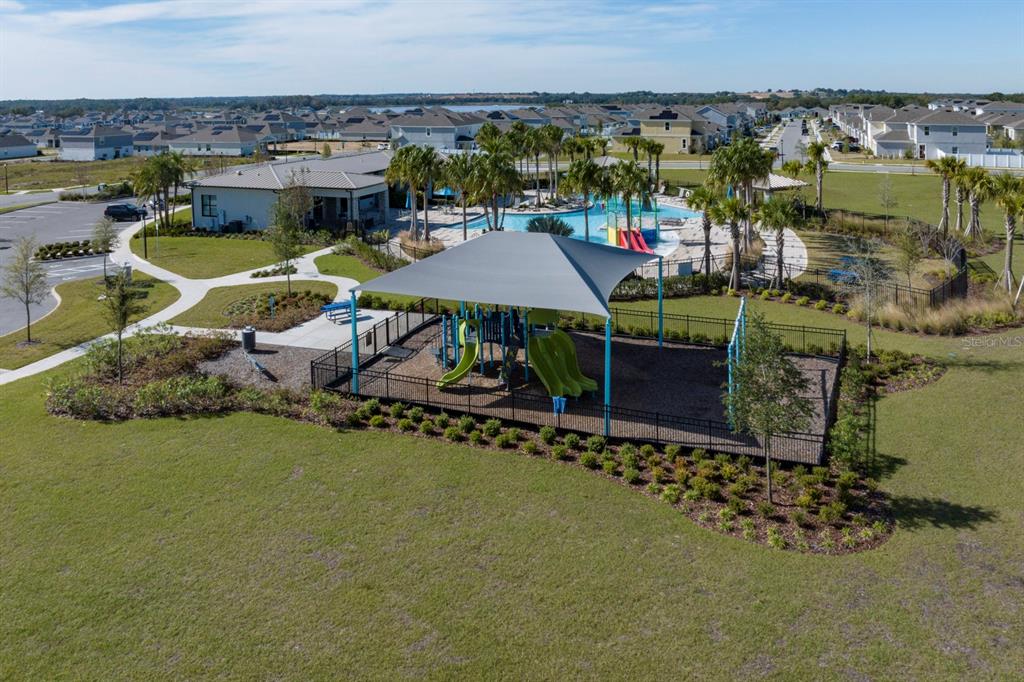 7036 Rolling Leaf Road Groveland, FL 34736 - Photo 16 of 18 an aerial view of a house with a garden