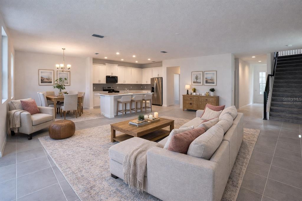 7036 Rolling Leaf Road Groveland, FL 34736 - Photo 5 of 18 a living room with furniture and a view of kitchen