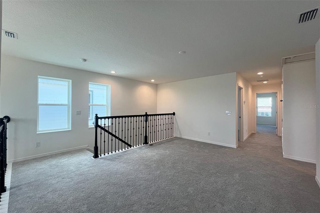 7036 Rolling Leaf Road Groveland, FL 34736 - Photo 6 of 18 a view of an empty room