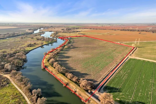 an aerial view of a house with swimming pool garden and mountain view