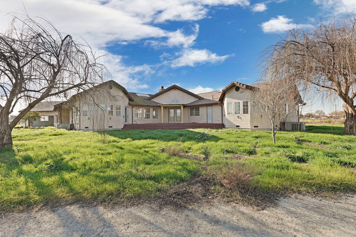 16321 South Wing Levee Road Stockton, CA 95206 - Photo 16 of 71 a view of a house with a big yard