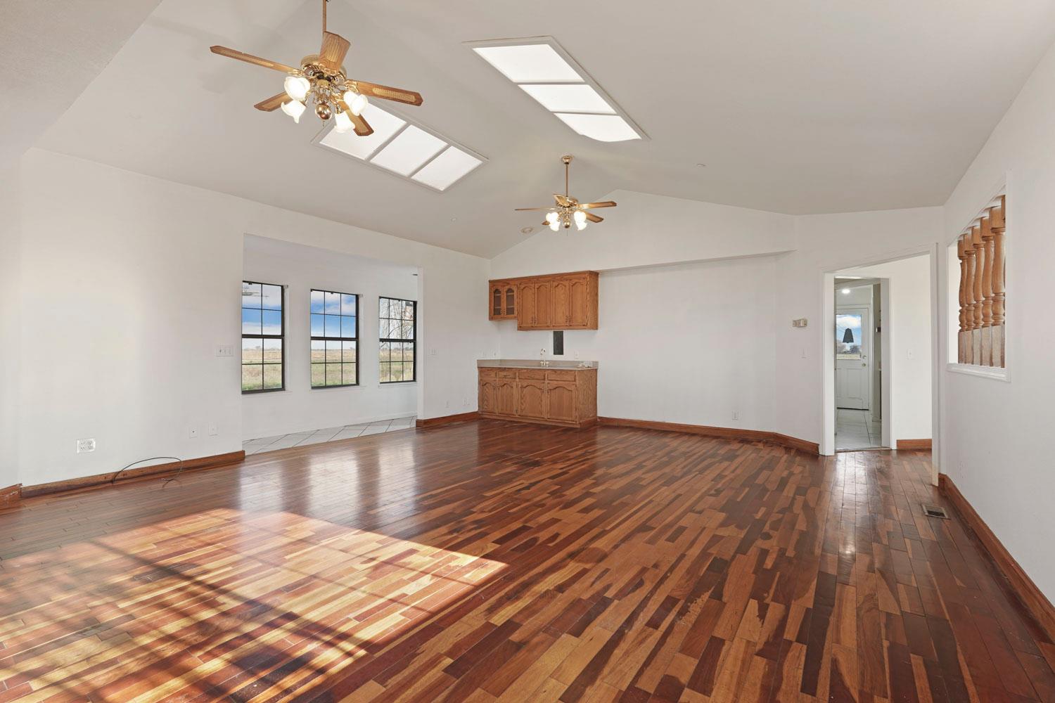 16321 South Wing Levee Road Stockton, CA 95206 - Photo 29 of 71 a view of empty room with wooden floor and fan