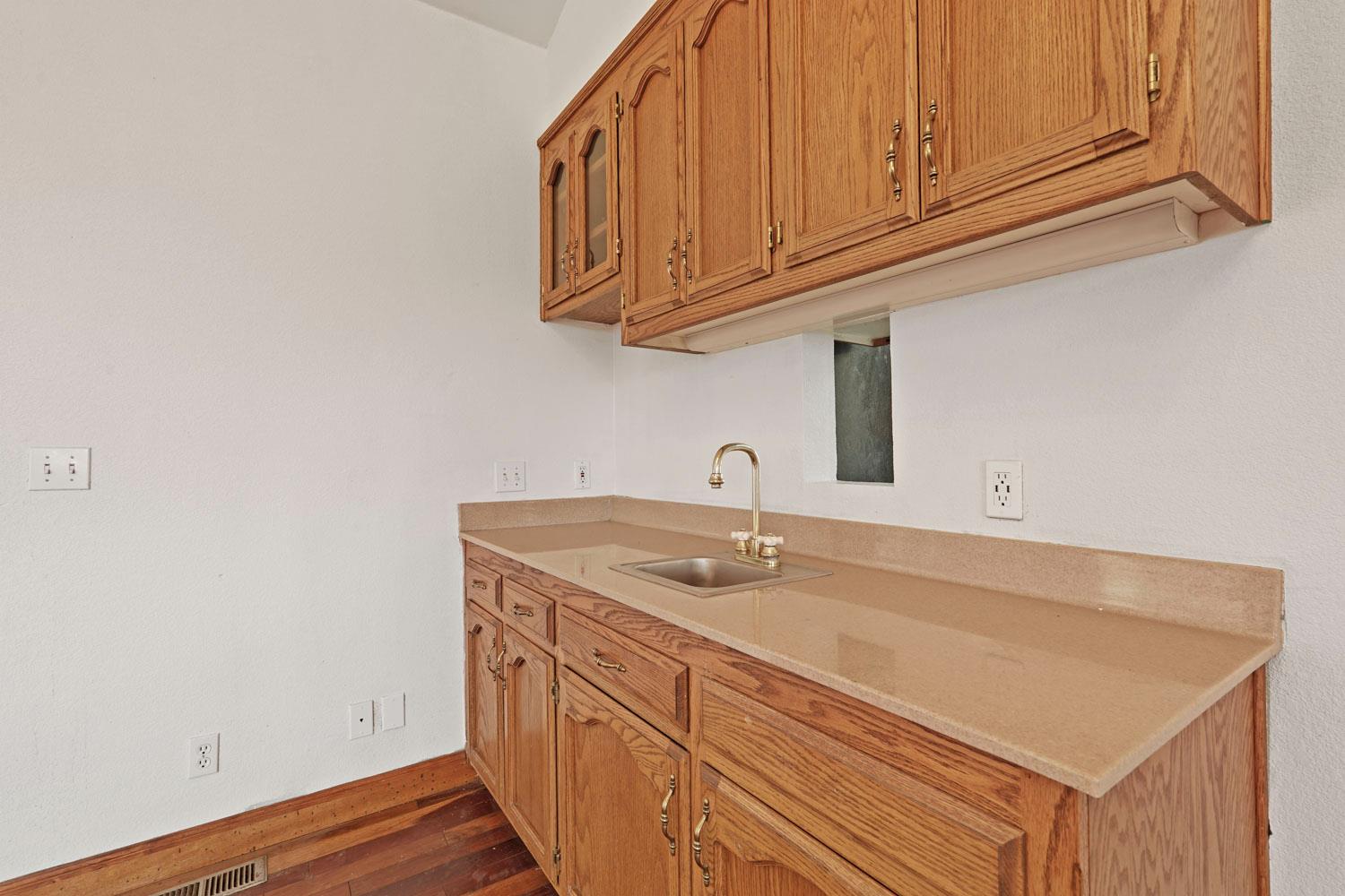 16321 South Wing Levee Road Stockton, CA 95206 - Photo 30 of 71 a kitchen with a sink cabinets and utility