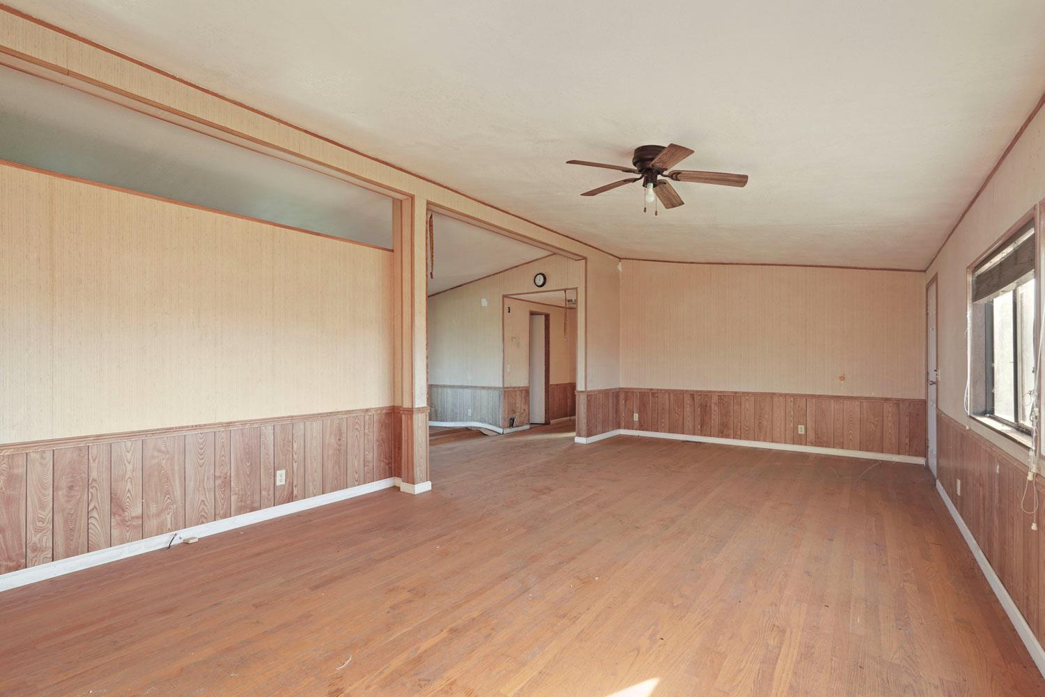 16321 South Wing Levee Road Stockton, CA 95206 - Photo 31 of 71 wooden floor in an empty room with a window