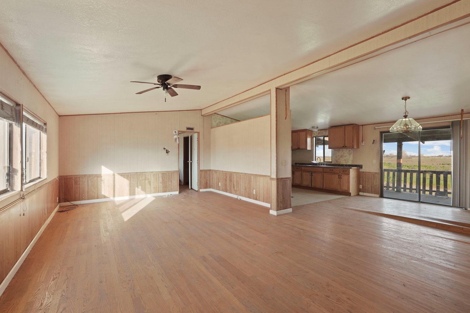 16321 South Wing Levee Road Stockton, CA 95206 - Photo 32 of 71 a view of empty room with wooden floor and fan