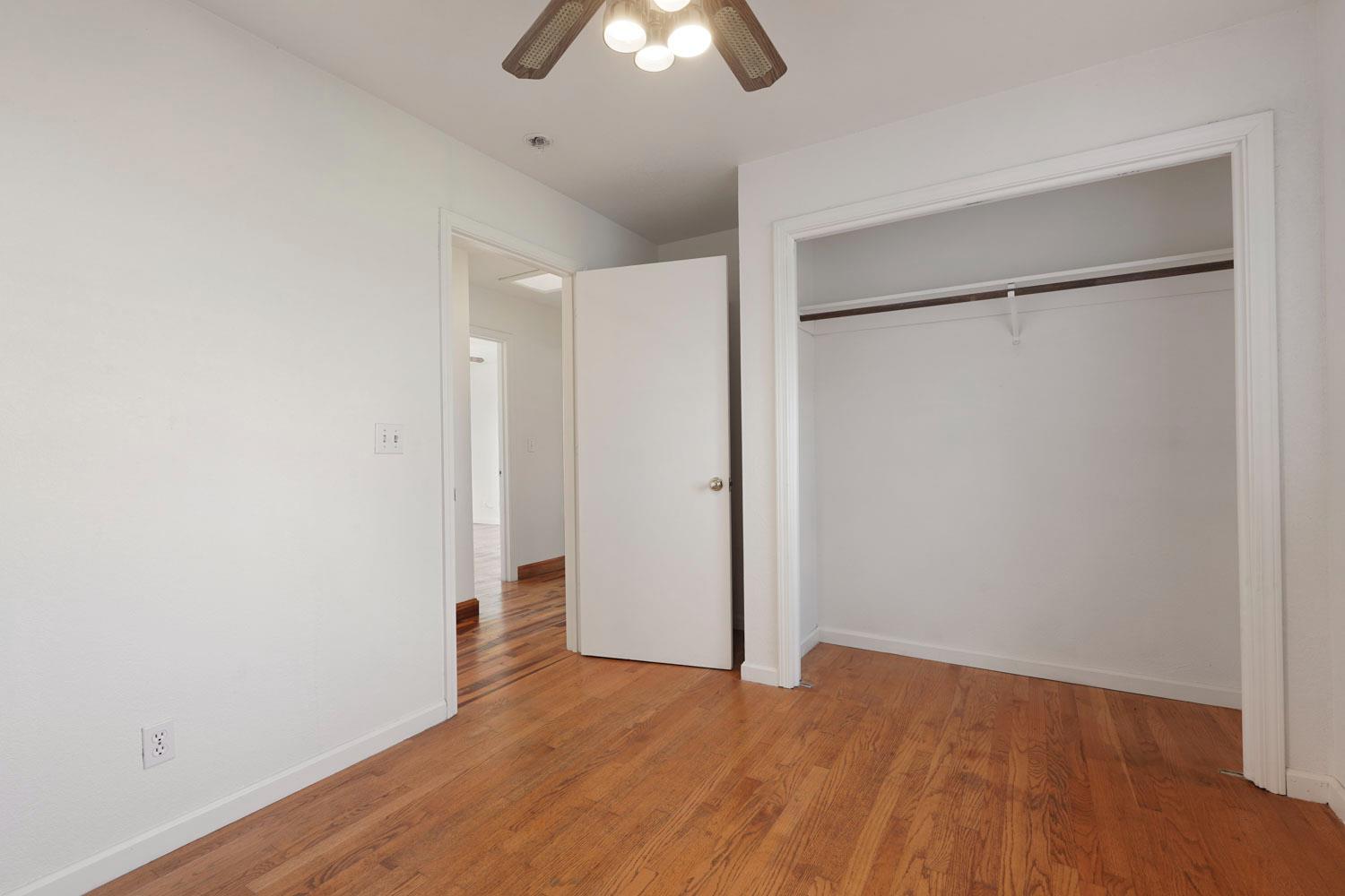 16321 South Wing Levee Road Stockton, CA 95206 - Photo 36 of 71 a view of empty room with wooden floor