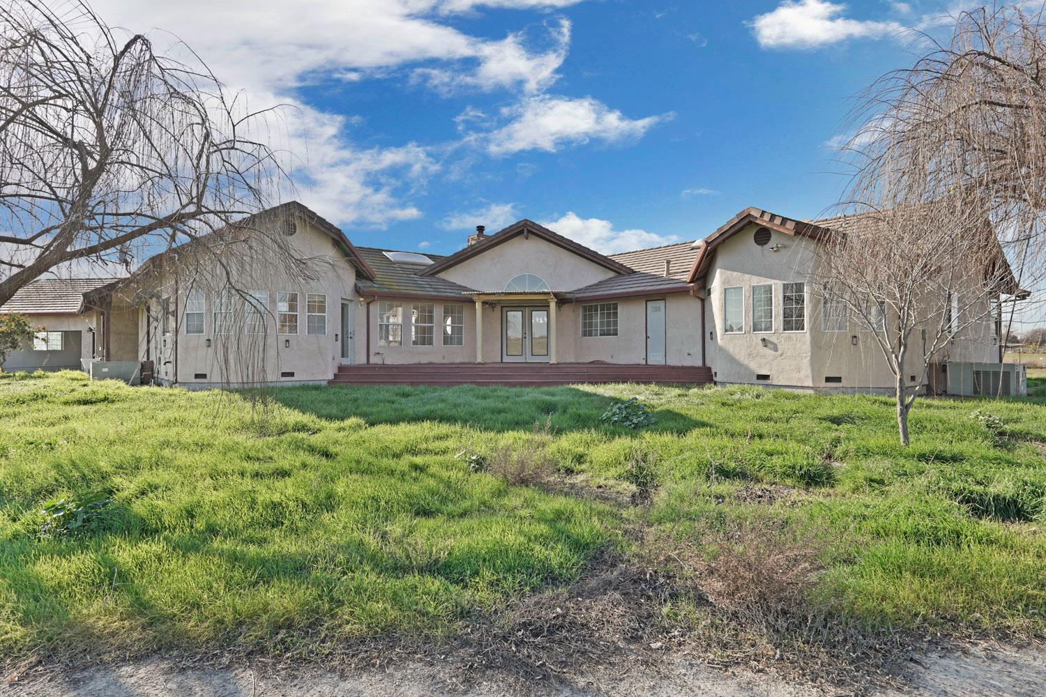 16321 South Wing Levee Road Stockton, CA 95206 - Photo 66 of 71 a front view of a house with a garden