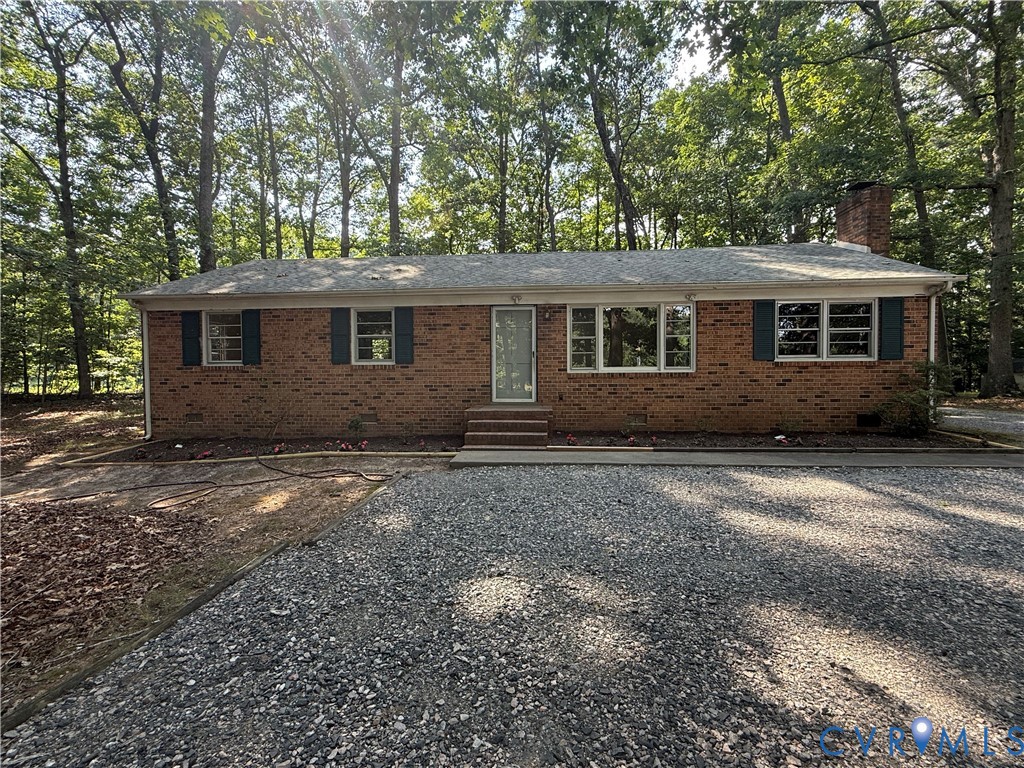 12720 Bailey Bridge Road Midlothian, VA 23112 - Photo 1 of 2 Brick ranch home featuring a gravel driveway, matu