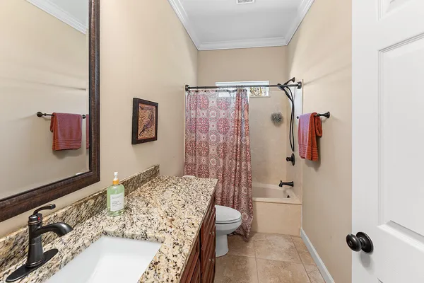 a view of a bathroom from a hallway