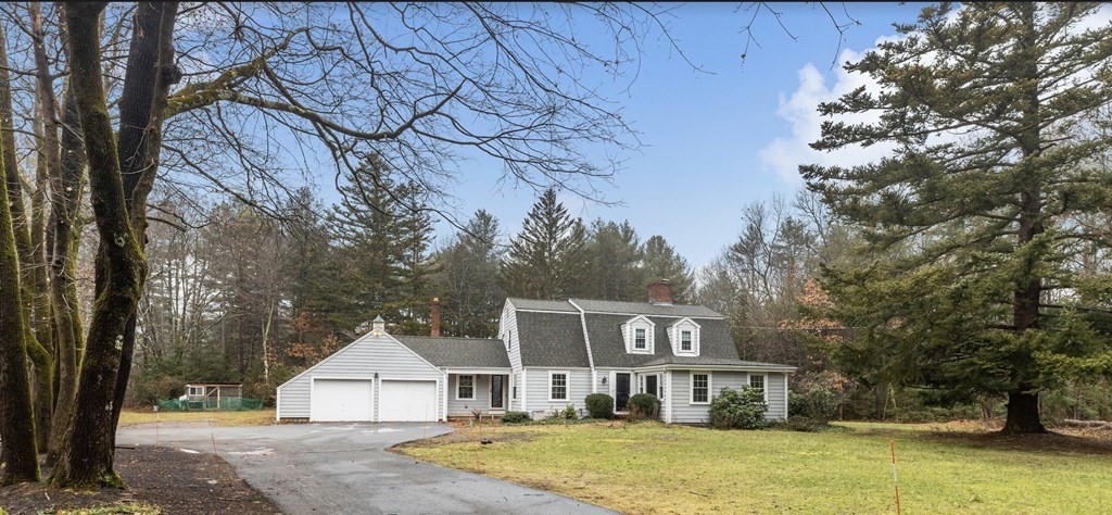 14 Kelsey Road Boxford, MA 01921 - Photo 1 of 39 a front view of a house with a yard and garage
