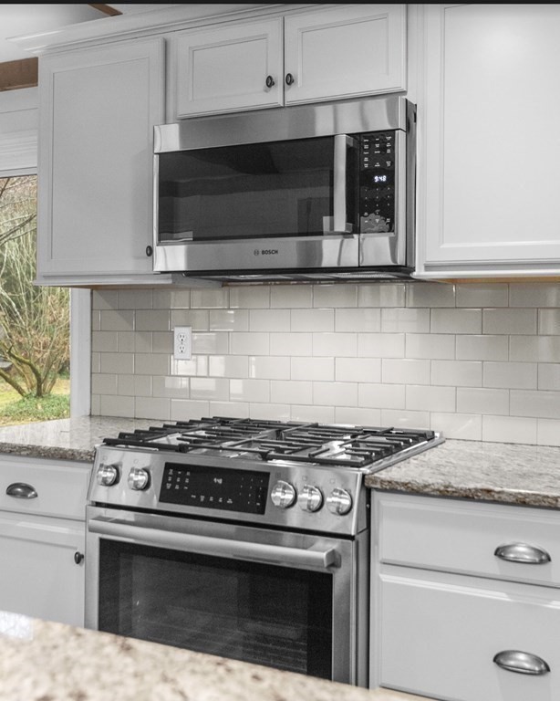 14 Kelsey Road Boxford, MA 01921 - Photo 5 of 39 a stove top oven sitting inside of a kitchen