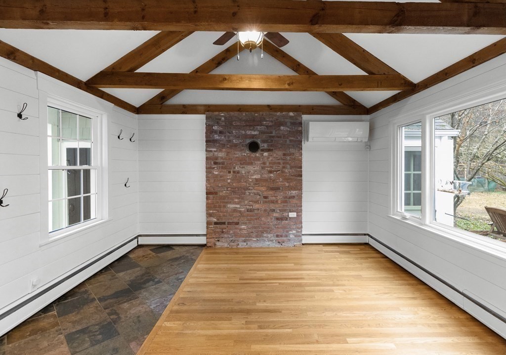 14 Kelsey Road Boxford, MA 01921 - Photo 8 of 39 a view of empty room with a fireplace and windows
