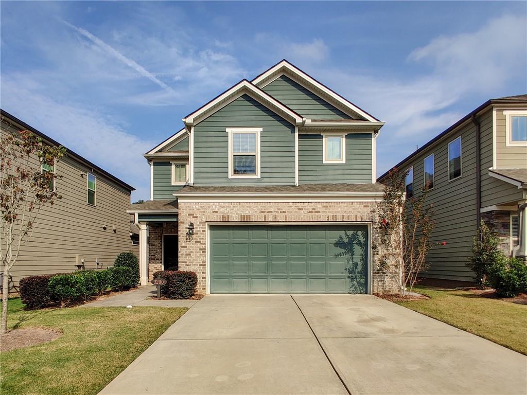 3200 Morgan Road Buford, GA 30519 - Photo 1 of 1 a front view of a house with a yard and garage