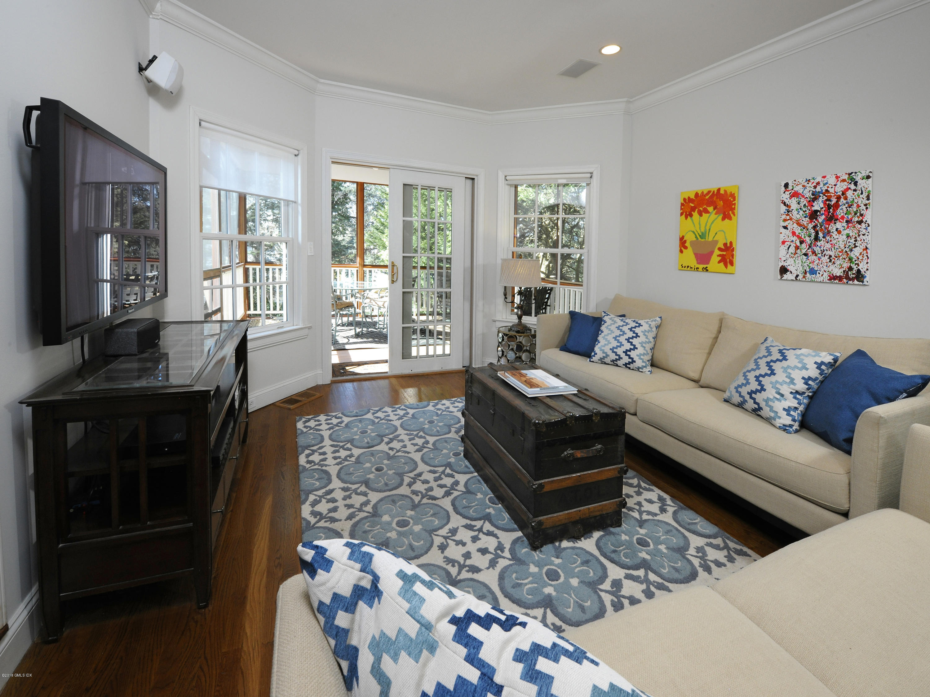 14 Druid Lane Riverside, CT 06878 - Photo 11 of 32 a living room with furniture and a flat screen tv