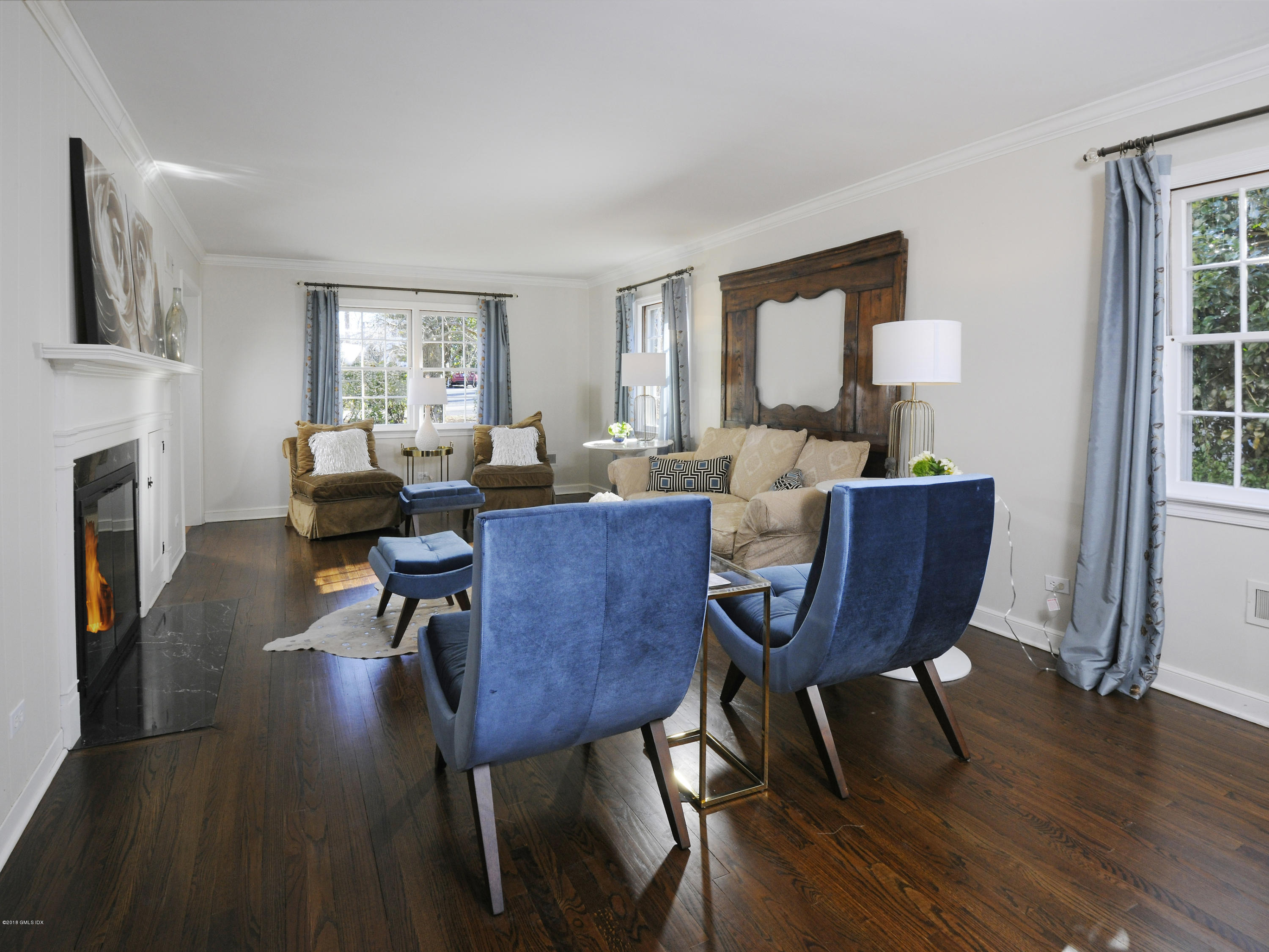 14 Druid Lane Riverside, CT 06878 - Photo 3 of 32 a living room with fireplace furniture wooden floor and a window