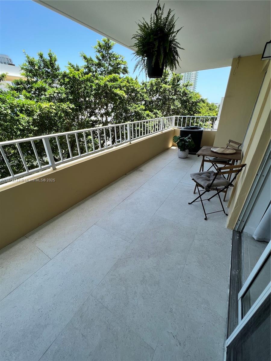 3304 Virginia Street, Unit 6B Miami, FL 33133 - Photo 11 of 15 a view of a balcony with chairs