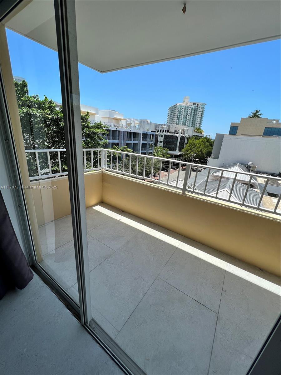 3304 Virginia Street, Unit 6B Miami, FL 33133 - Photo 12 of 15 a view of a balcony with city view