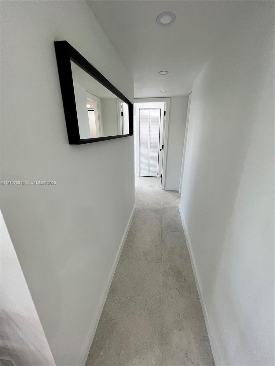3304 Virginia Street, Unit 6B Miami, FL 33133 - Photo 4 of 15 a view of a hallway with closet