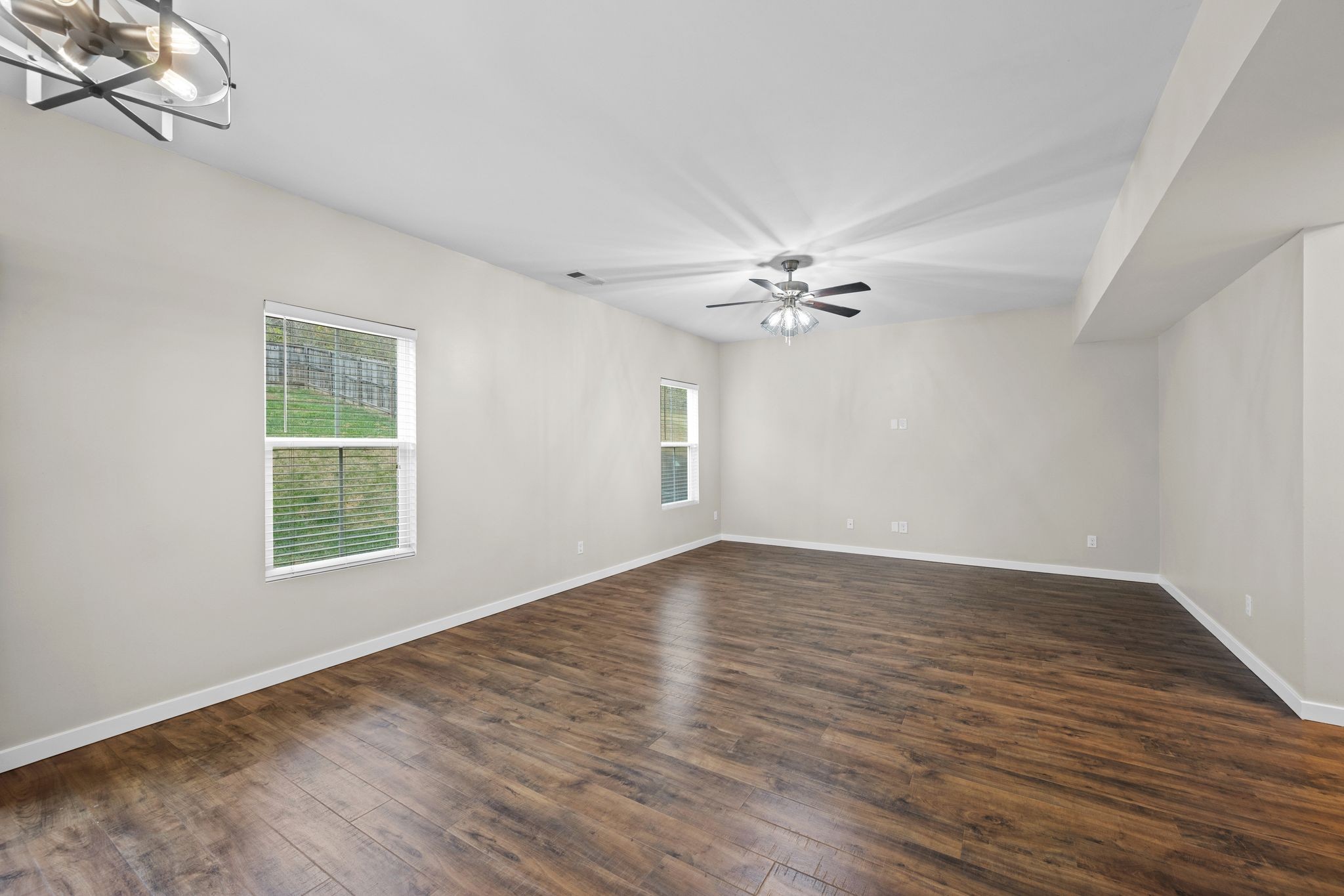 2569 Jordan Ridge Drive Nashville, TN 37218 - Photo 12 of 46 a view of an empty room with wooden floor and a window