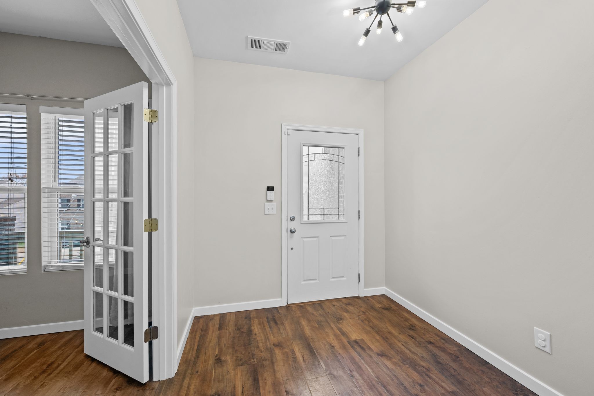2569 Jordan Ridge Drive Nashville, TN 37218 - Photo 5 of 46 wooden floor in an empty room with a window