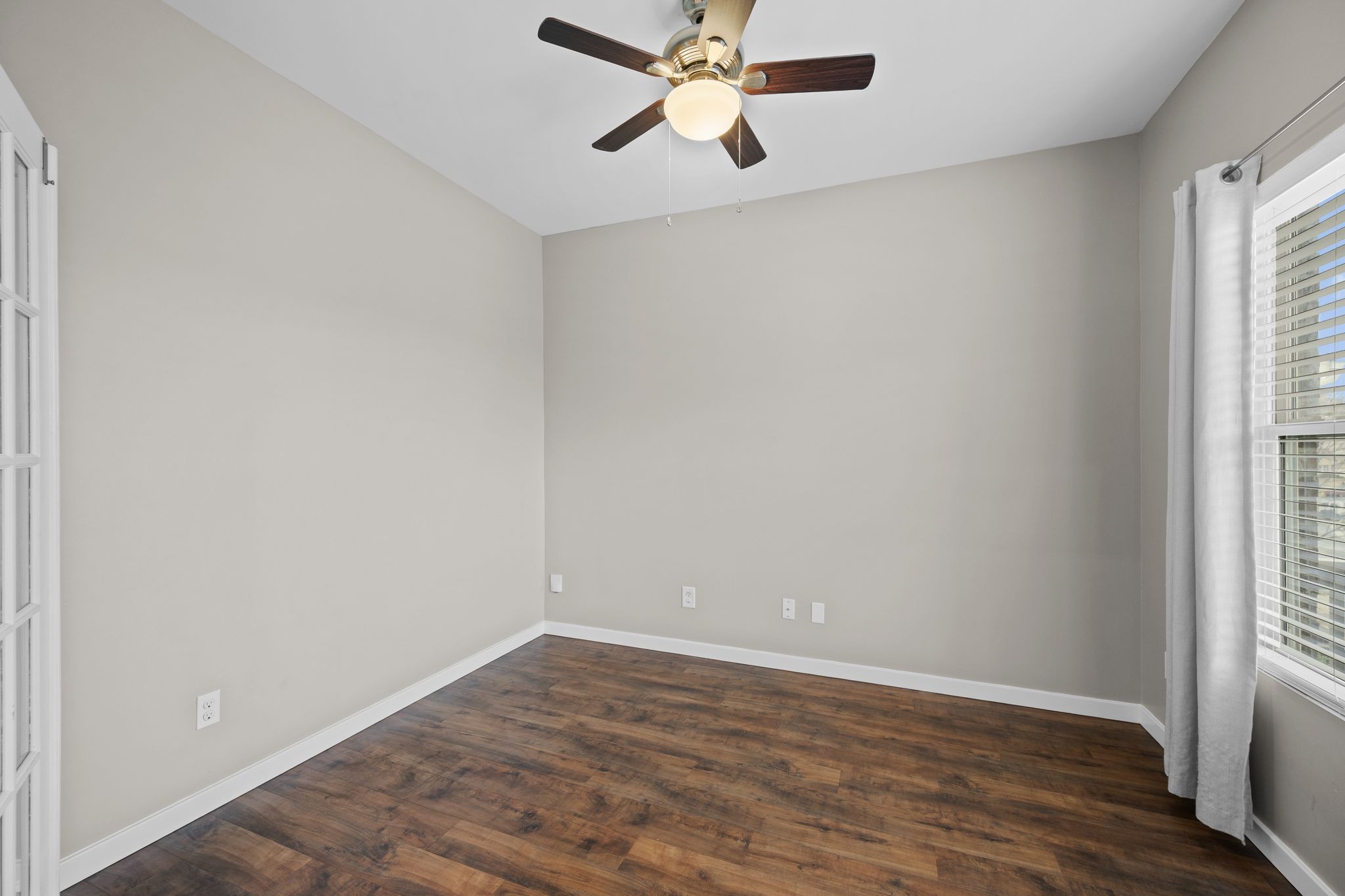 2569 Jordan Ridge Drive Nashville, TN 37218 - Photo 8 of 46 an empty room with wooden floor fan and windows