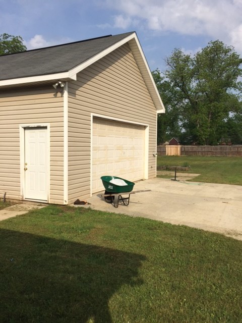 6793 Houston Road Macon, GA 31216 - Photo 20 of 22 a view of a backyard with a garden
