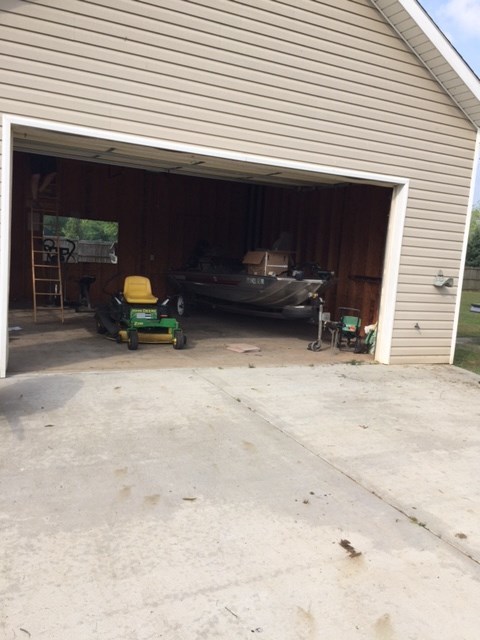 6793 Houston Road Macon, GA 31216 - Photo 22 of 22 a view of room with furniture and a garage