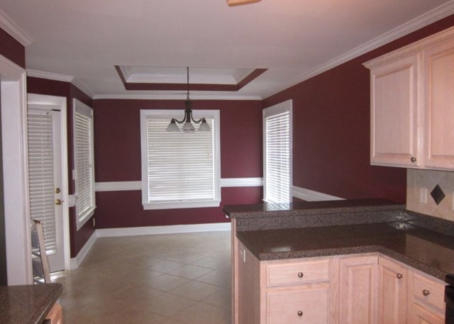 6793 Houston Road Macon, GA 31216 - Photo 5 of 22 a kitchen with stainless steel appliances a sink stove and cabinets