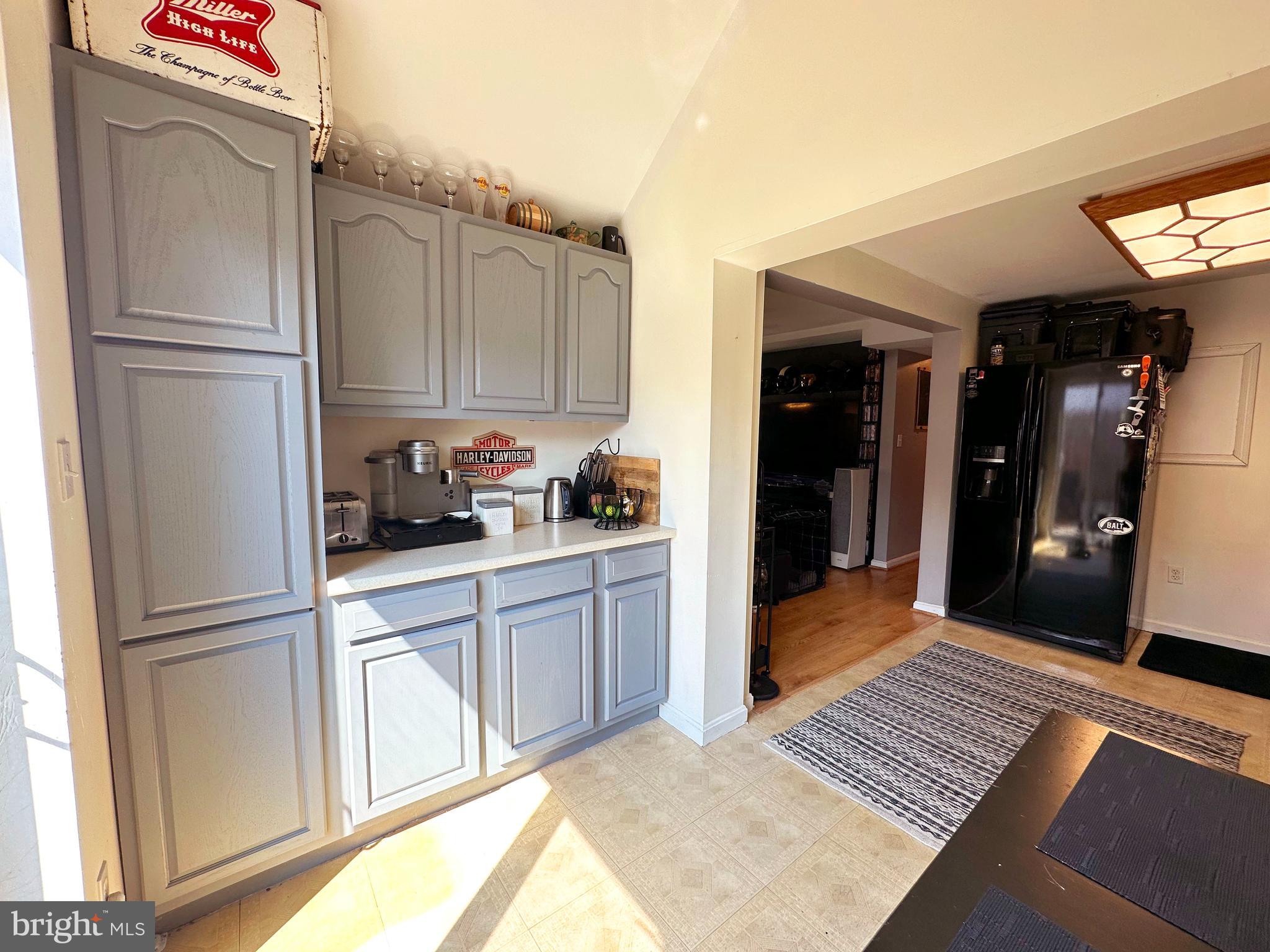 7811 Meath Road Baltimore, MD 21222 - Photo 15 of 52 a kitchen with stainless steel appliances granite countertop a refrigerator and a sink