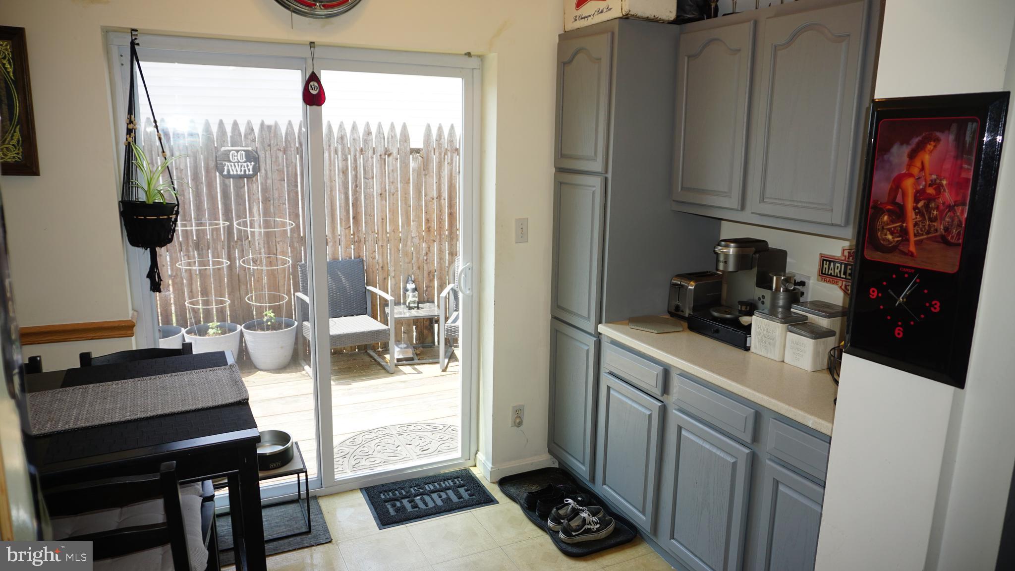 7811 Meath Road Baltimore, MD 21222 - Photo 17 of 52 a kitchen with sink refrigerator and stove