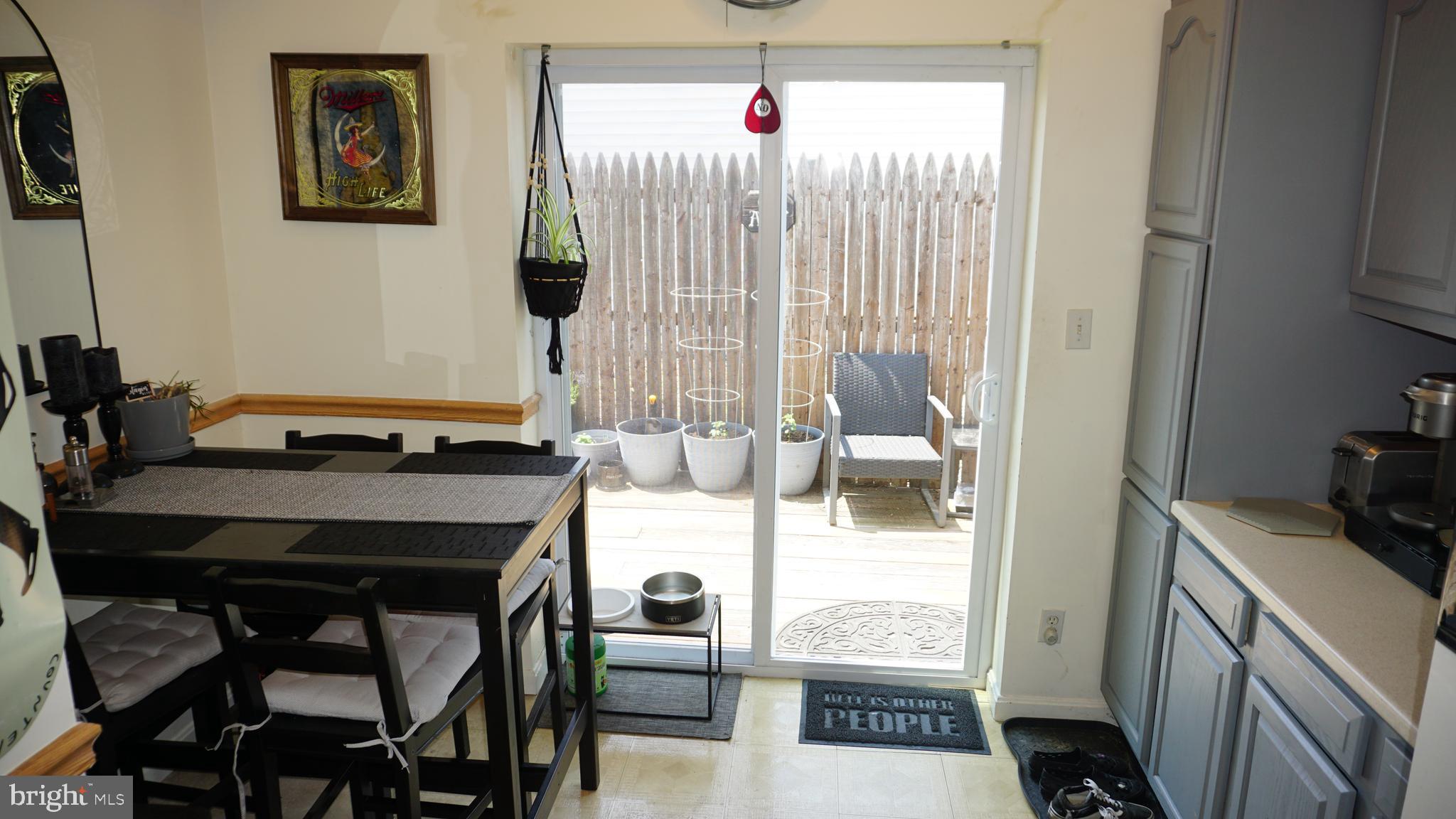 7811 Meath Road Baltimore, MD 21222 - Photo 20 of 52 a kitchen with a table and chairs