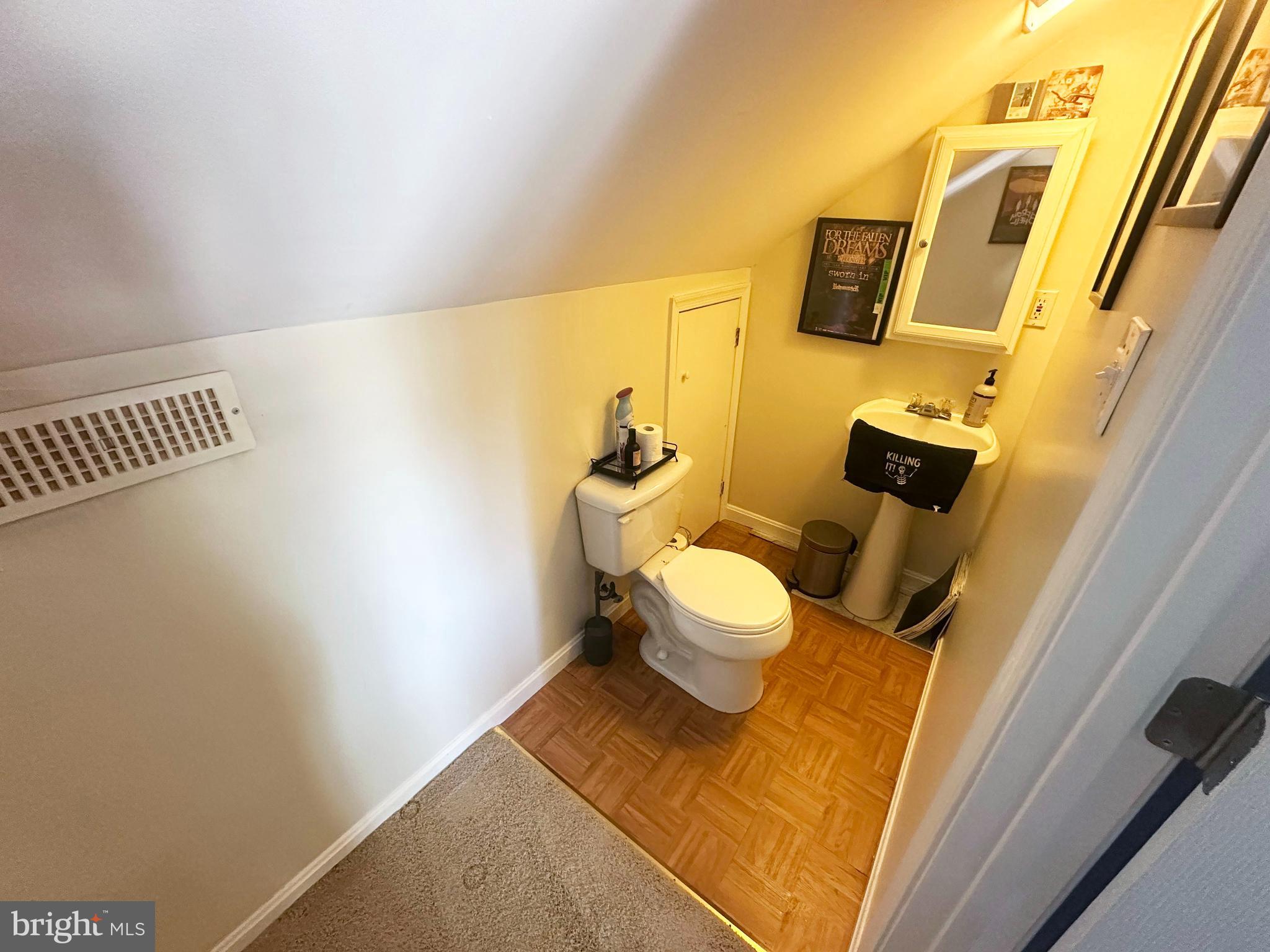 7811 Meath Road Baltimore, MD 21222 - Photo 21 of 52 a bathroom with a sink and a toilet