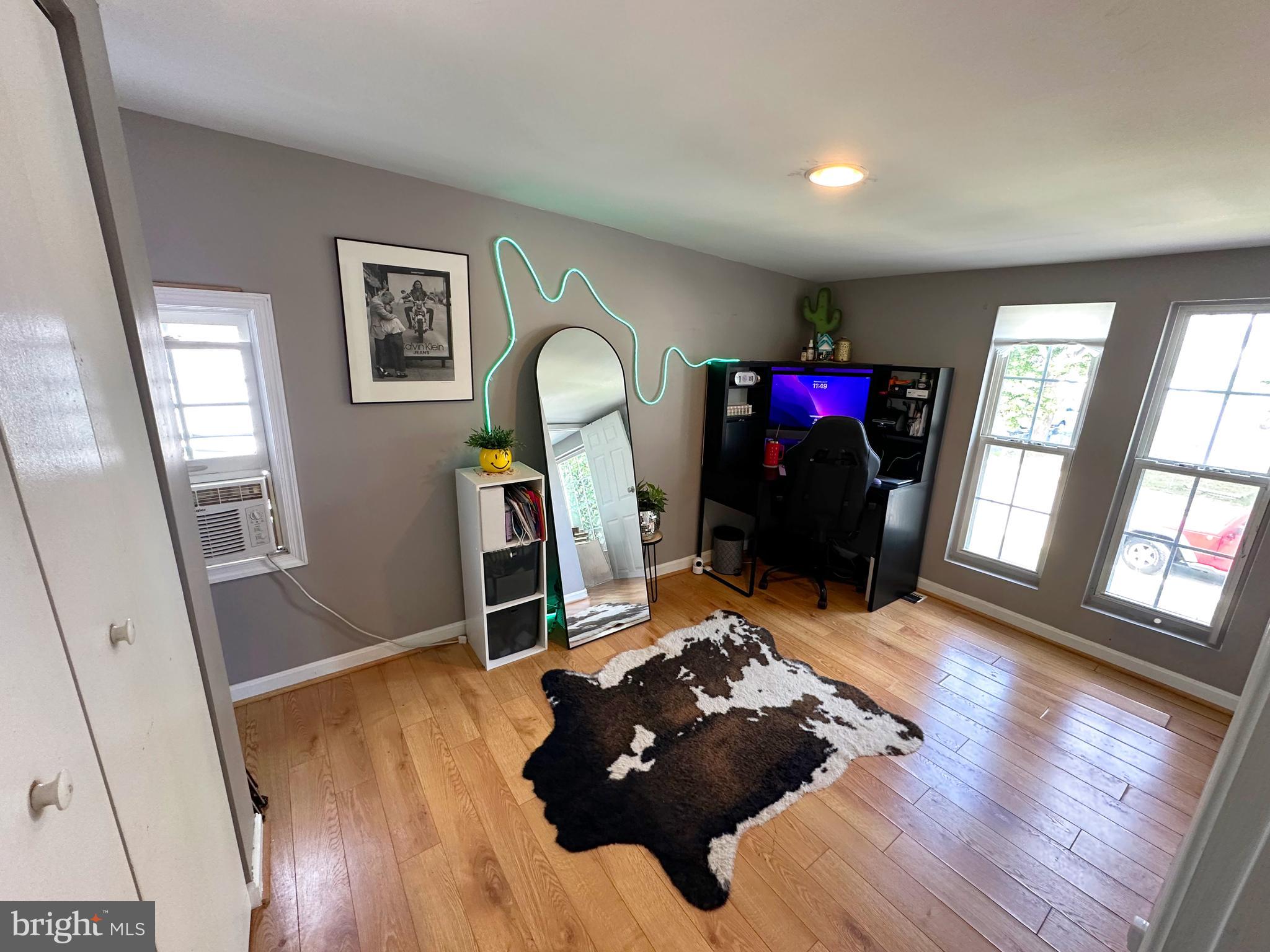 7811 Meath Road Baltimore, MD 21222 - Photo 22 of 52 a living room with furniture and a wooden floor