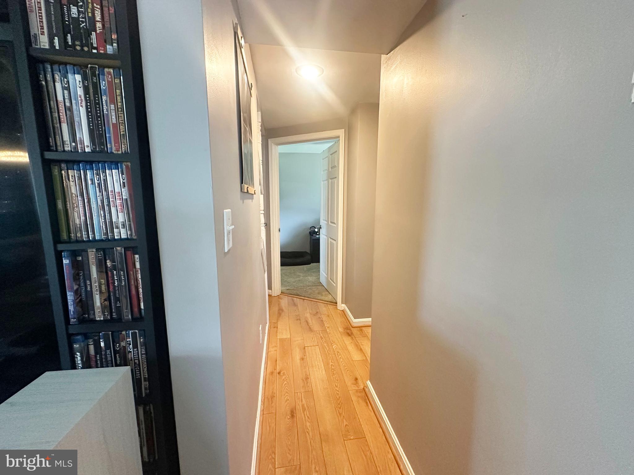 7811 Meath Road Baltimore, MD 21222 - Photo 24 of 52 a view of a hallway with wooden floor and staircase