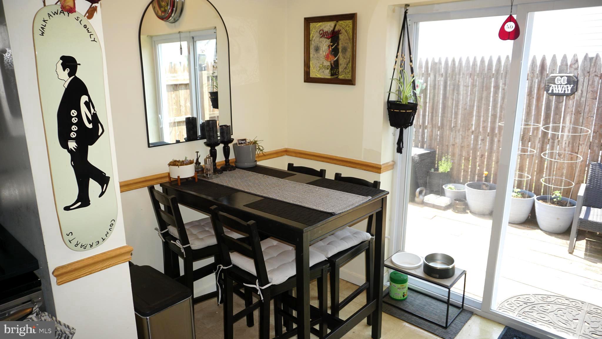 7811 Meath Road Baltimore, MD 21222 - Photo 30 of 52 a view of a dining room with furniture and wooden floor