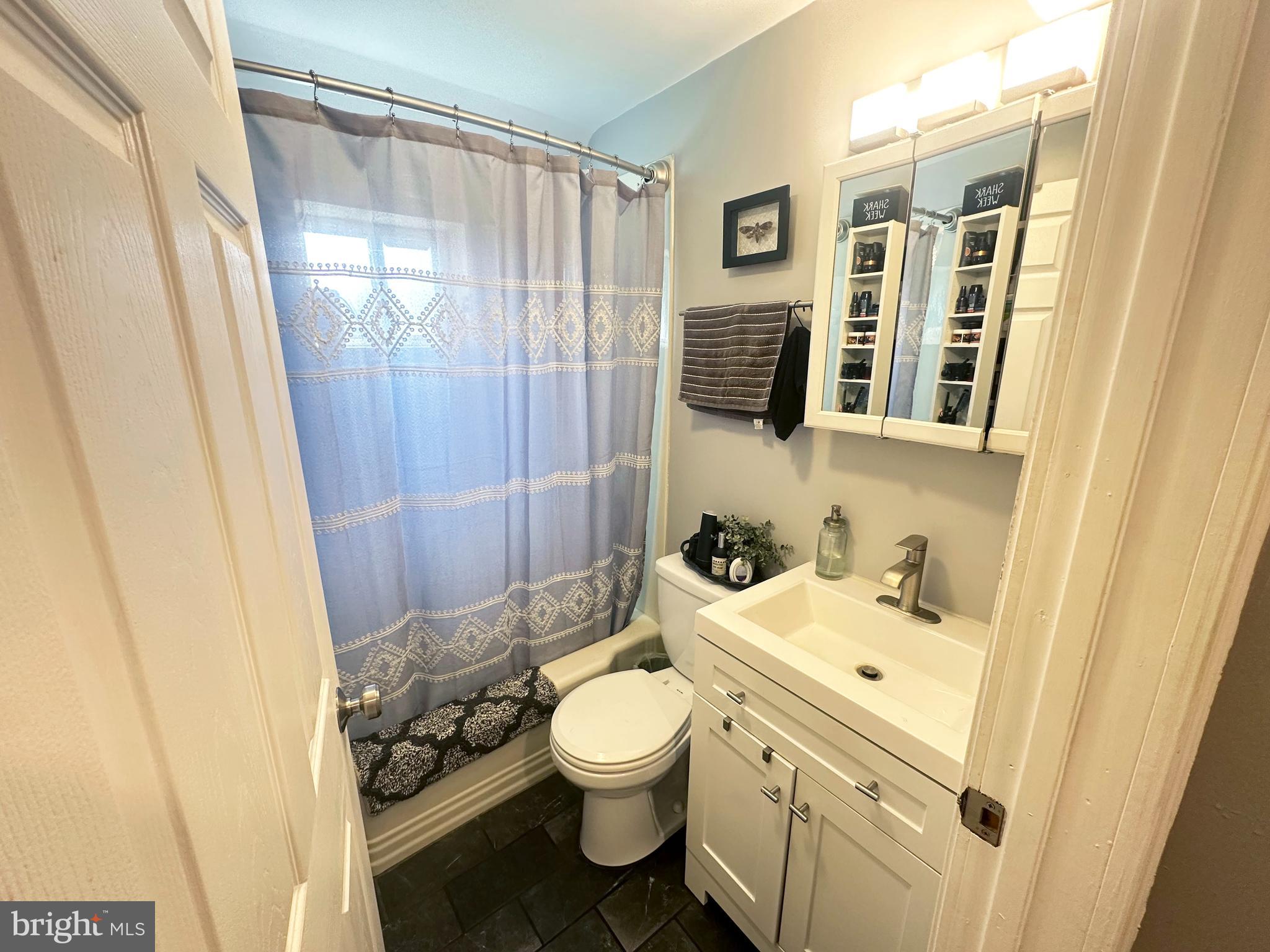 7811 Meath Road Baltimore, MD 21222 - Photo 3 of 52 a bathroom with a toilet sink and shower