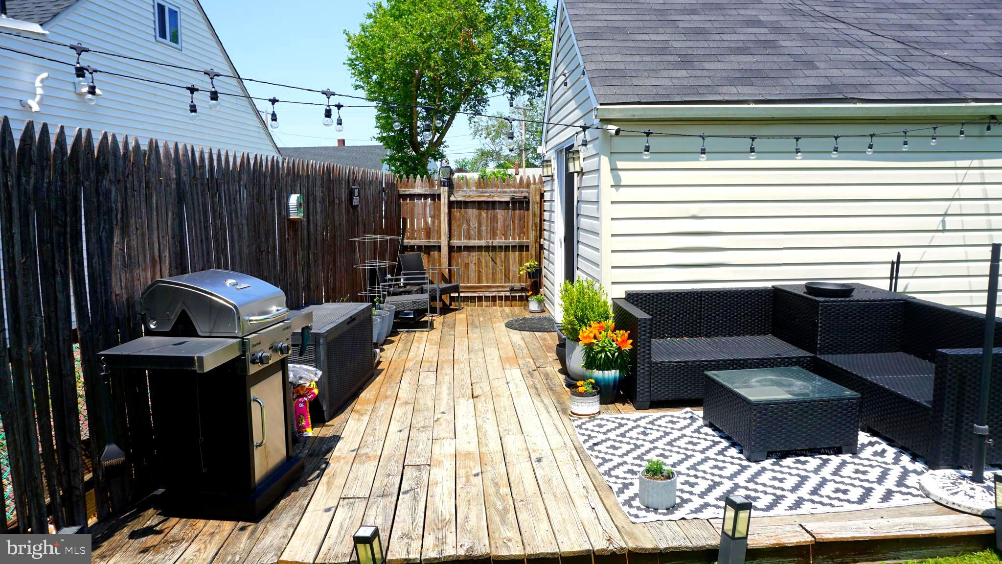 7811 Meath Road Baltimore, MD 21222 - Photo 40 of 52 a view of a patio with a table and chairs