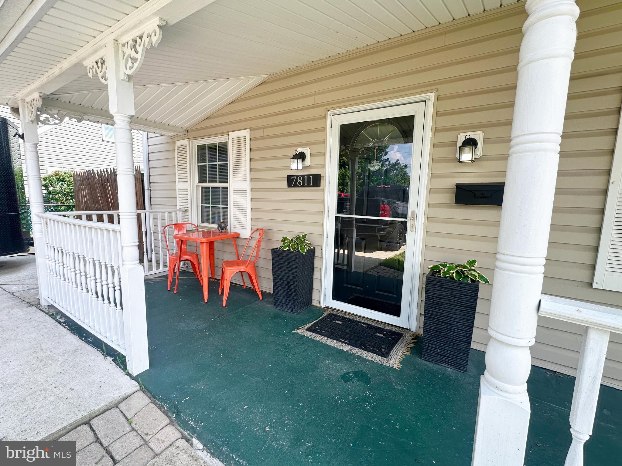 7811 Meath Road Baltimore, MD 21222 - Photo 51 of 52 a view of a porch with chairs and a table and chair