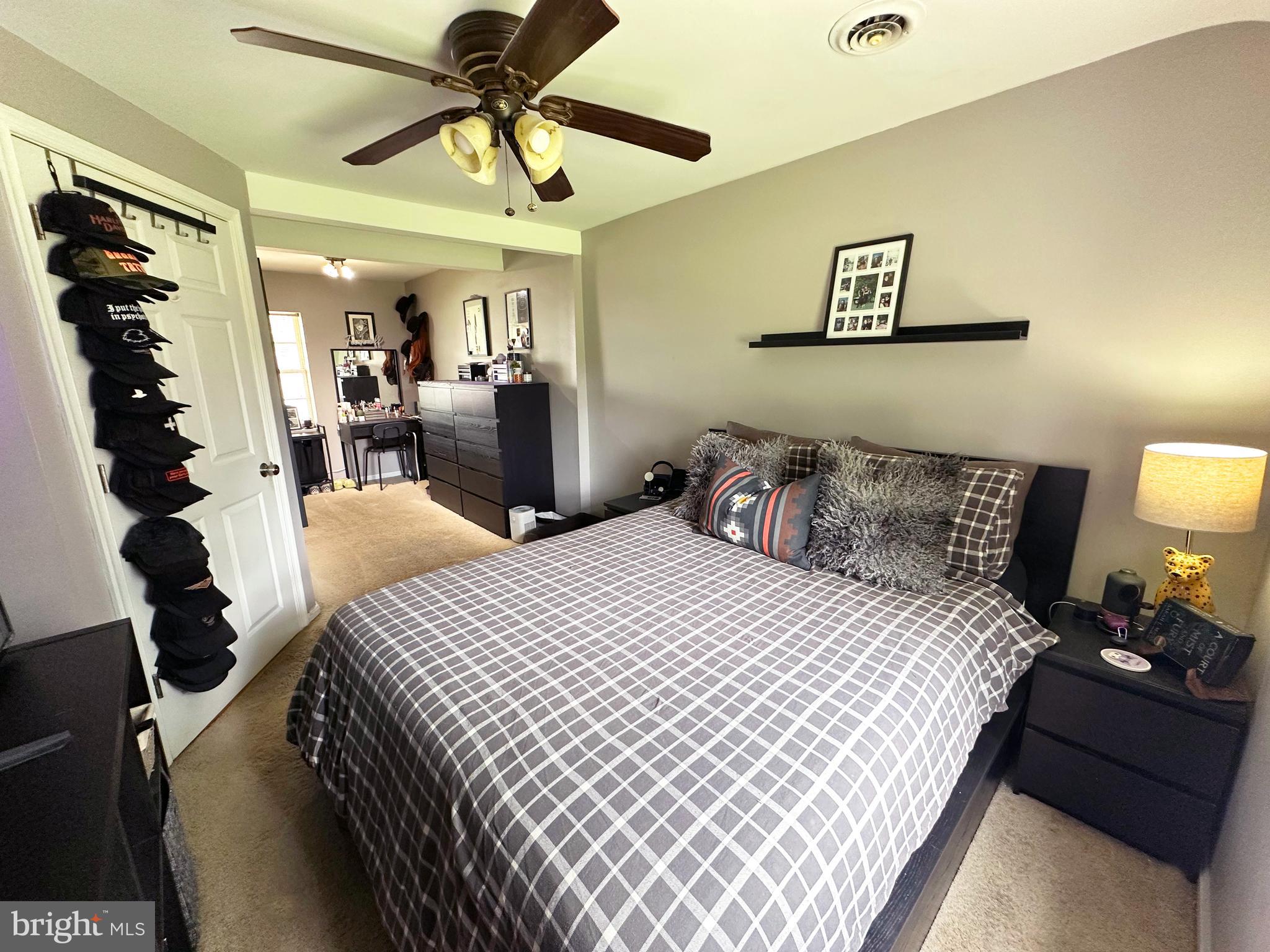 7811 Meath Road Baltimore, MD 21222 - Photo 7 of 52 a bedroom with bed and a chandelier