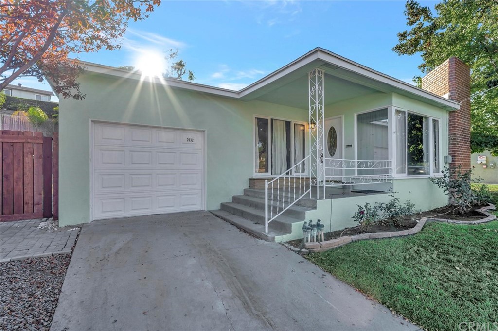 2832 Locust Street Riverside, CA 92501 - Photo 1 of 1 a front view of a house with a yard