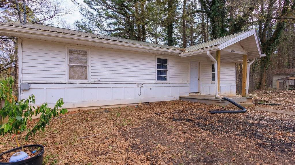 251 Killian Street Canton, GA 30114 - Photo 2 of 10 a house with trees in front of it