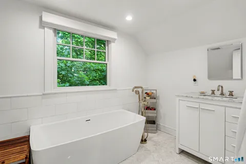 a bathroom with a bathtub and a sink
