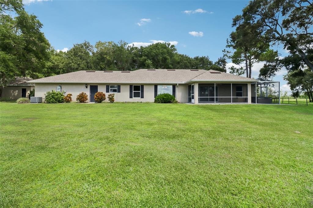 40610 Babb Road Umatilla, FL 32784 - Photo 1 of 45 a front view of a house with a garden