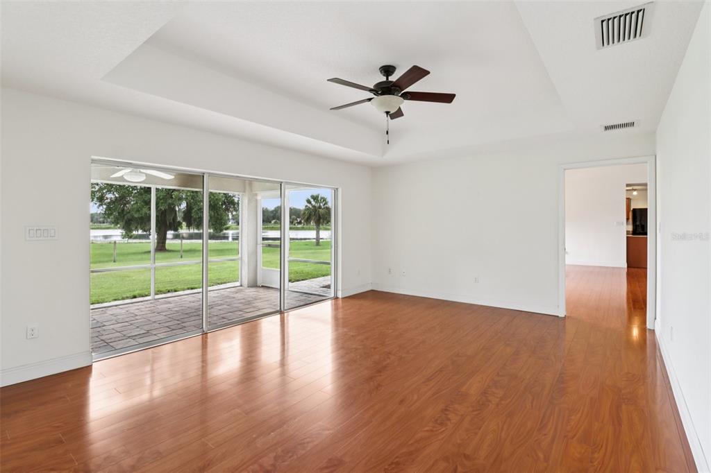 40610 Babb Road Umatilla, FL 32784 - Photo 16 of 45 a view of an empty room with wooden floor and a window