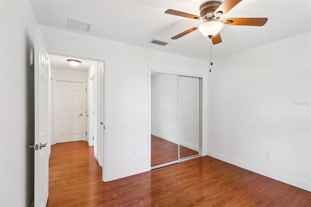 40610 Babb Road Umatilla, FL 32784 - Photo 18 of 45 a view of an empty room with wooden floor